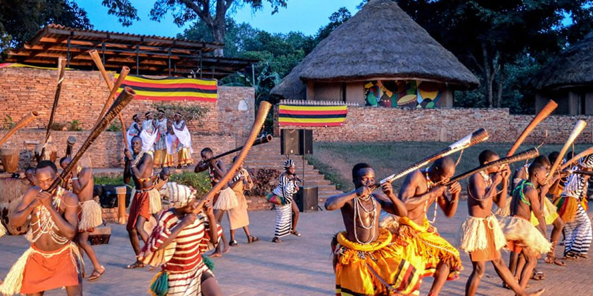 MIANA tourists interacting with Ugandan villagers, tasting traditional food, and participating in a local cultural dance ceremony.